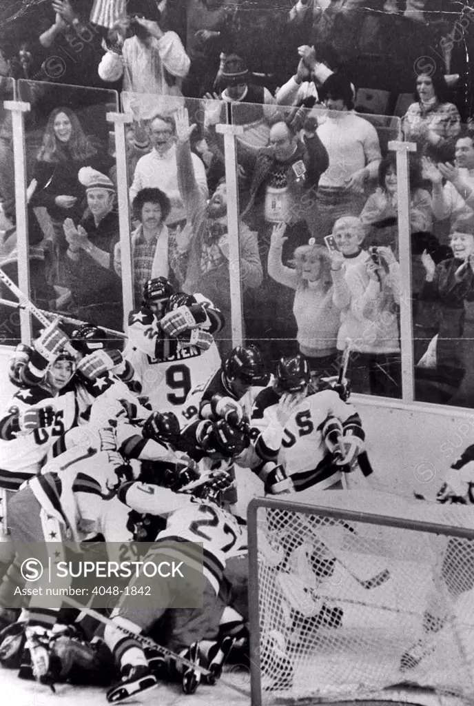 OLYMPIC GAMES-U.S. Olympic Hockey Team celebrates its 4 to 3 victory ofver the U.S.S.R Olympic Hockey Team. 1980