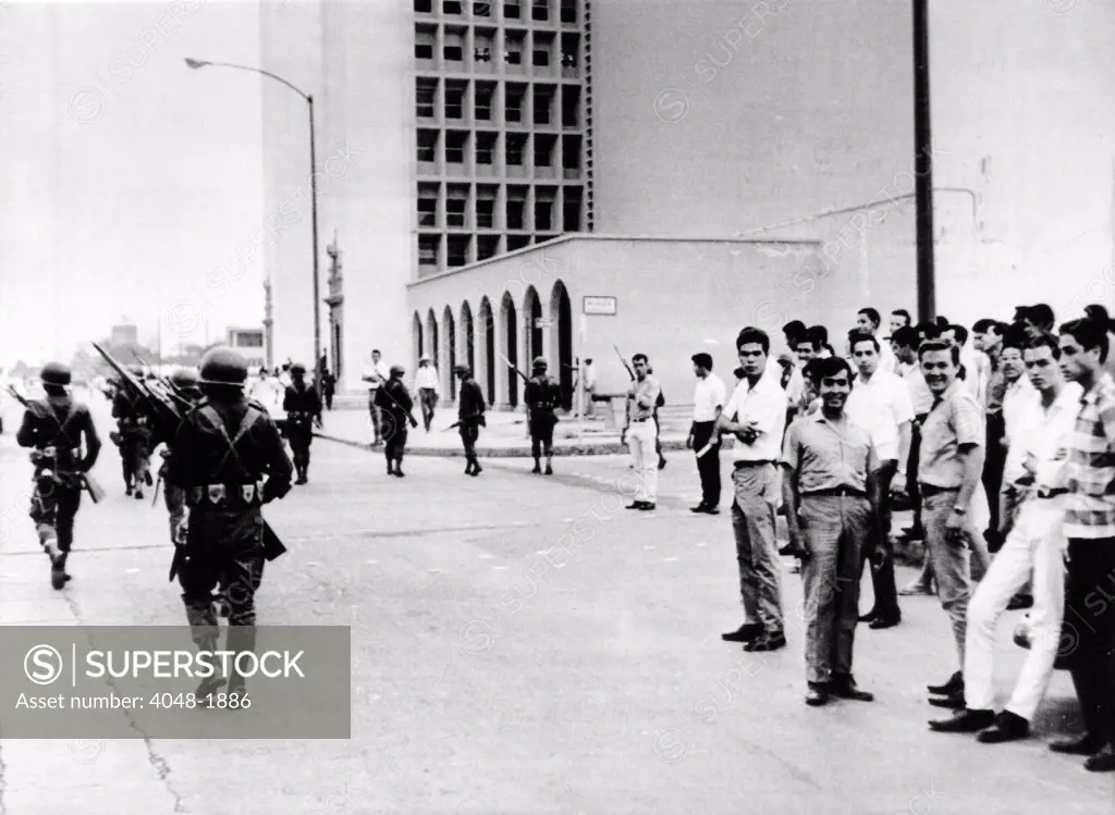 Hermosillo, Mexico: Mexican Army paratroopers patrol the campus of the University of Sonora as it reopens for classes after a two-month student strike that led to rioting and resulted in an army takeover.  May 22, 1967.