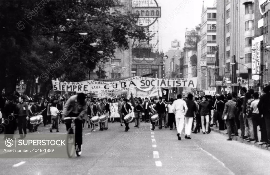 Mexico City: Leftist student and communist sympathizers begin a march towards downtown Mexico City to commemorate Fidel Castro's rise to power in Cuba.  The demonstration ended in a bloody riot. August 27, 1968.