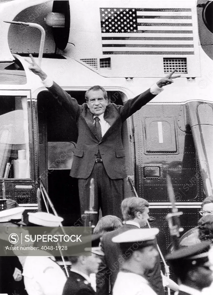 RICHARD NIXON waves with both arms as he bids an emotional farewell to members of his staff after his resignation for the Presidency of the United States. Washington, D.C. 8/8/74.