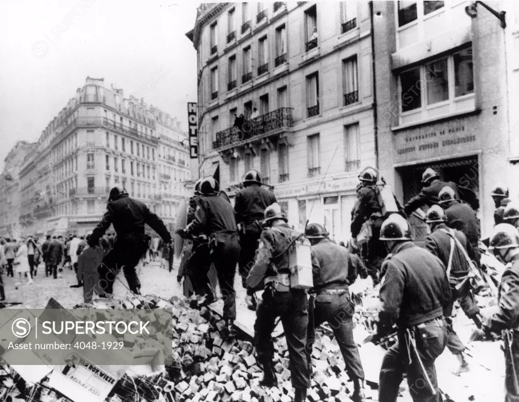 RIOTS-Riot police on barricade in the Latin Quarter of Paris during the riots of 1968.