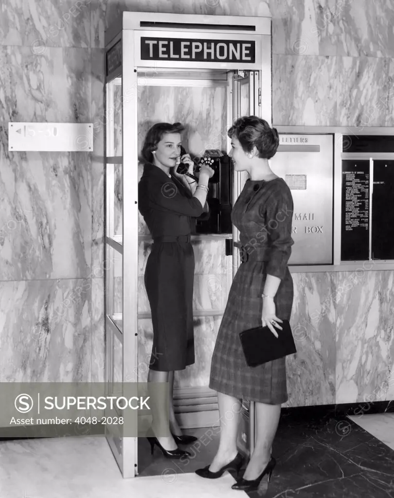 A new model phone booth introduced by Aluminum Company of American made for smaller locations than traditional phone booths, circa 1960s