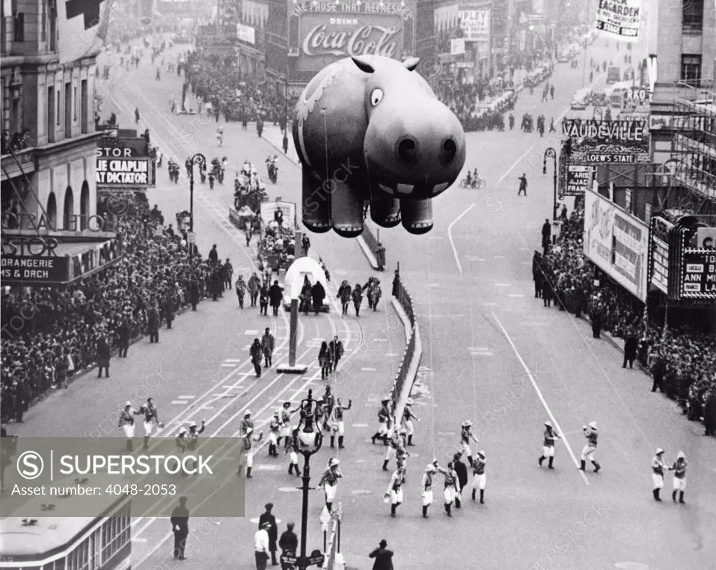 New York City, 1940. A hippo balloon floats over Times Square during the Macy's Thanksgiving Day Parade.