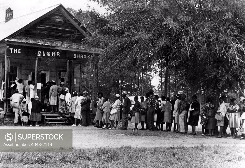 5/3/66--PEACHTREE, ALA--African Americans flock to this polling place in rural, Blackbelt, Alabama 5/3 as they vote in large numbers for the  first time in history. Typical of rural polling places is the Sugar Shack small store in Wilcox County where black people outnumber whites almost 3 to 1.