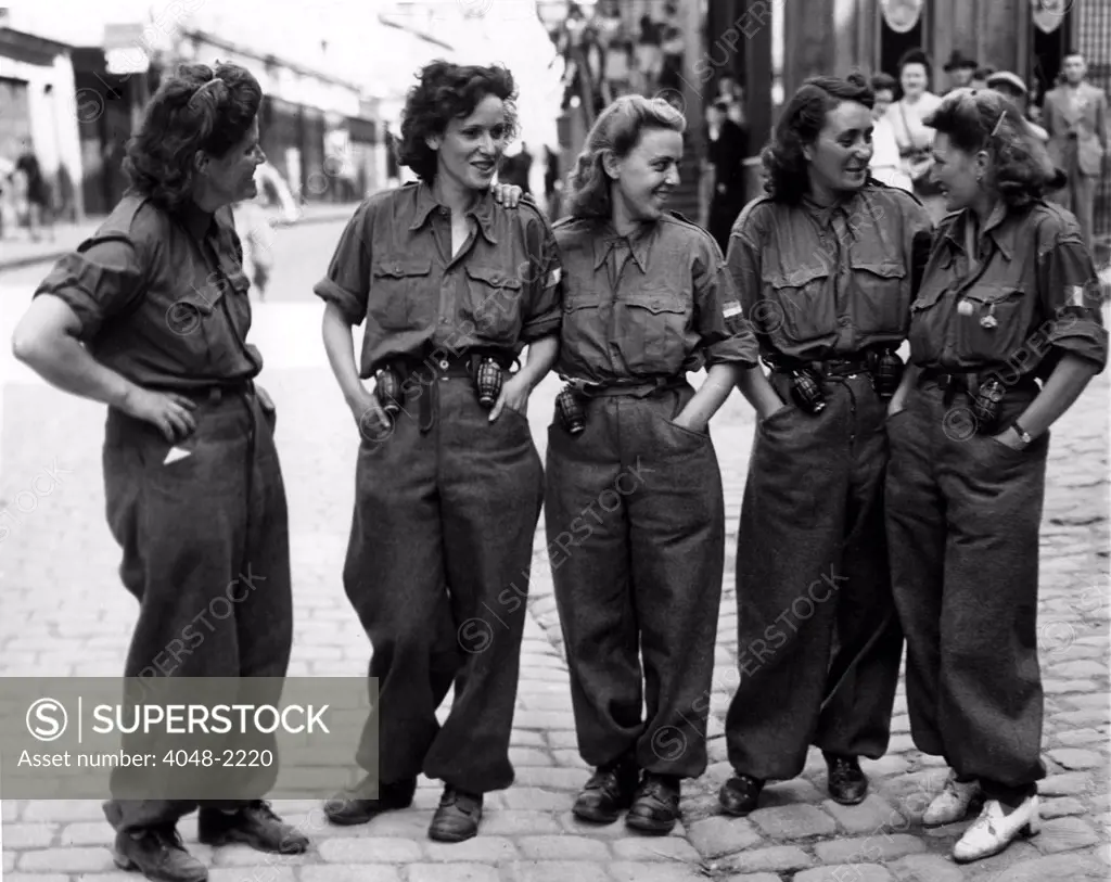 FRANCE-- These women are members of the FFI (French Forces of the Interior), acting as guides, scouts, and assisting in mopping up the Germans in captured towns. August 16, 1944