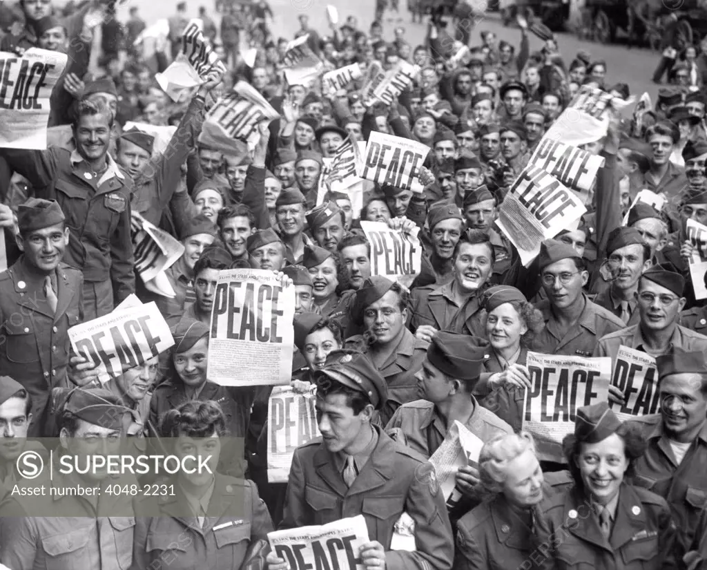 Service men and women send up cheers at news of Japanese capitulation, 9/2/45.
