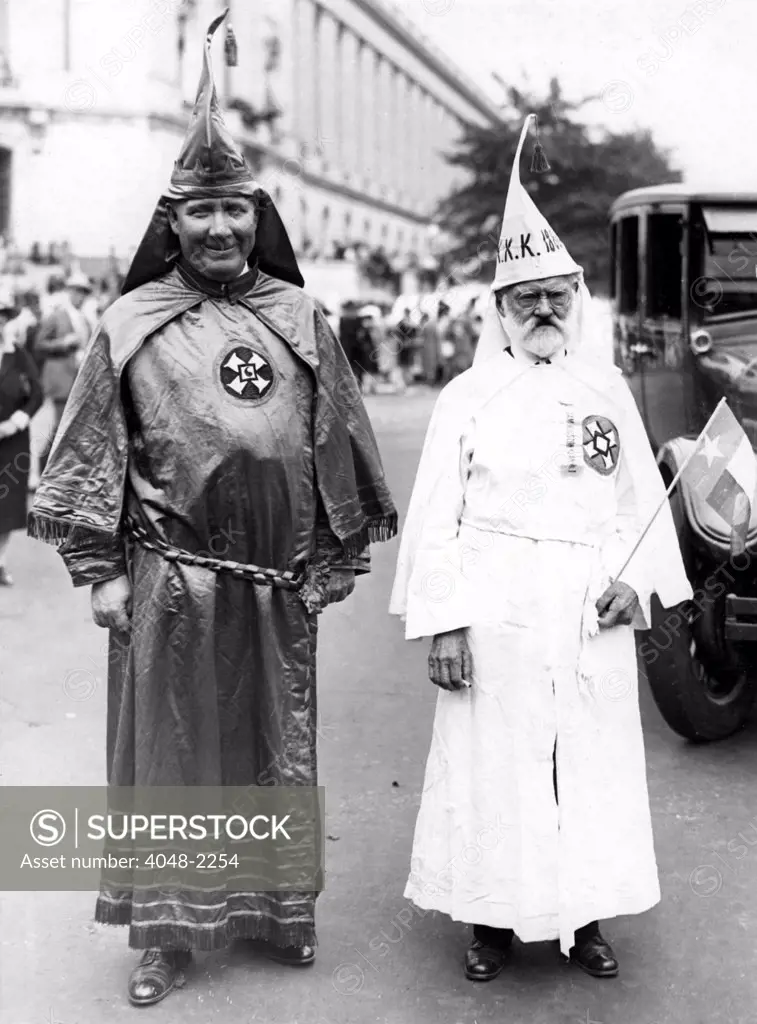 LEADERS OF THE KU KLUX KLAN CONVENTION PARADE  Dr. Hiram Wesley Evans, Imperial Wizard of the Ku Klux Klan, and J. M. Frezier of Houston, Texas, the oldest marcher, at the head of the parade of the hooded knights of the Invisible Empire during the convention of the Klan held in Washington, D.C. 1926