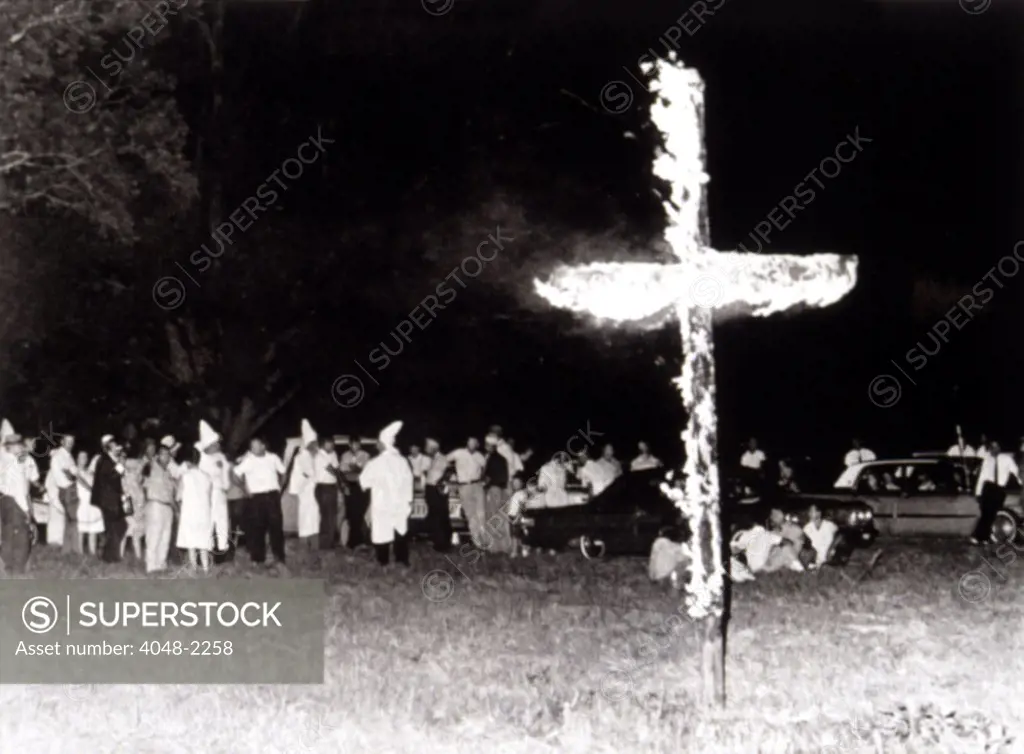 7/11/65--WAYNESBORO, GEORGIA--More than 100 robed  Ku Klux Klan members hold a rally.