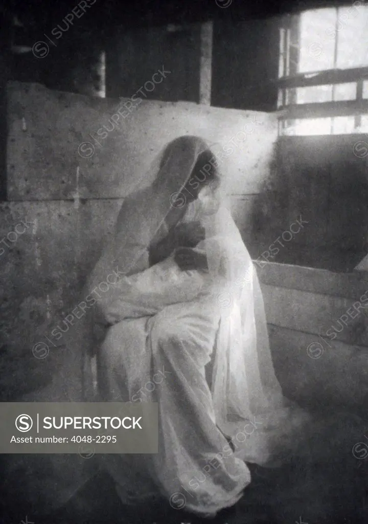 The Manger, by Gertrude Kasebier, shows a woman as the Virgin Mary posed as though breast feeding the baby Jesus, circa 1900.