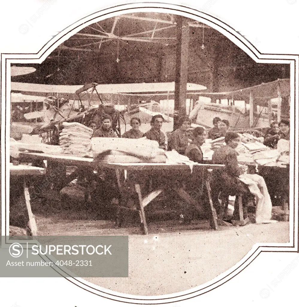 World War I, French women working at an airplane assembly plant sewing sleeves to cover the skeletons of rebuilt aircraft. The original caption reads: Winning the war from the clouds, / exclusive photographs by Helen Johns Kirtland, Leslie's Staff Correspondent. Images relating to the air war in France during World War I, 1919.