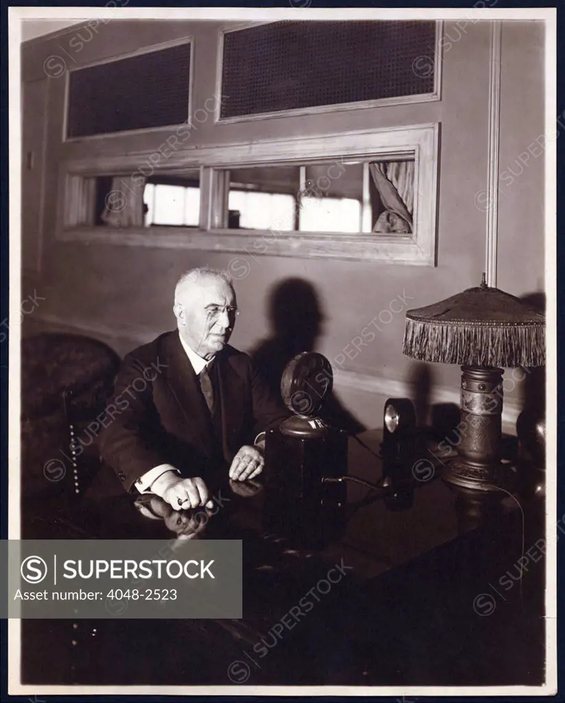 Emile Berliner (1851-1929), American inventor of the phonograph, seated in front of early microphone, circa 1926.