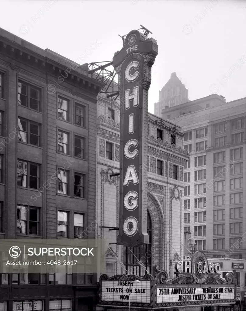 The Chicago Theater, constructed in 1921, photograph shows the sign and the Page Brothers building to the right, 175 North State Street, Chicago, Illinois, circa 1990s.