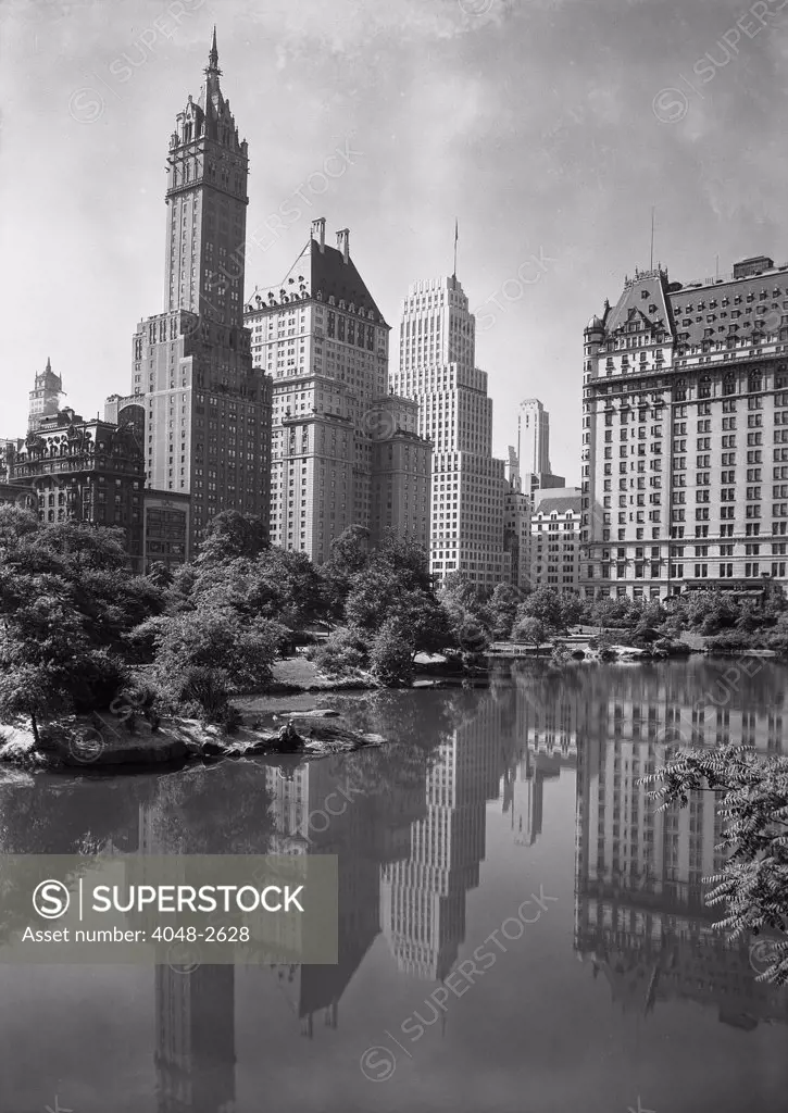 New York City, view of plaza buildings over park lake, photograph by Samuel H. Gottscho, January 23, 1933.