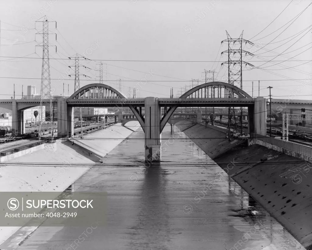 Los Angeles River and the Sixth Street Bridge, an example of Moderne design with detailing referred to as 'Starved Classicism', designed by Merrill Butler in 1932, Los Angeles, California photograph circa 1970s.