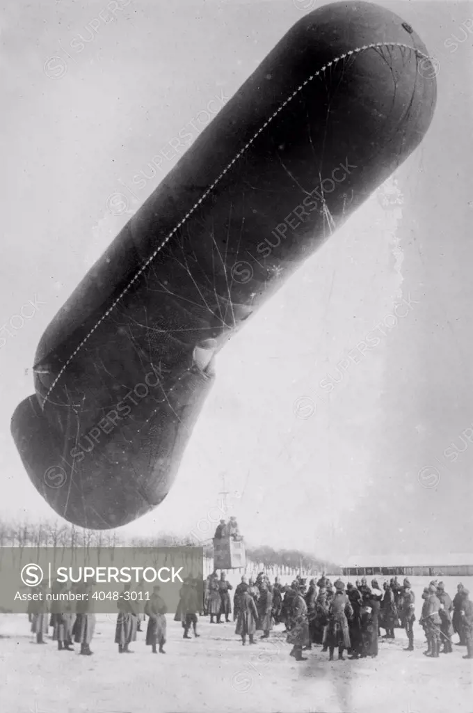 World War I, German observation balloon in snow with soldiers, circa 1914-1918.