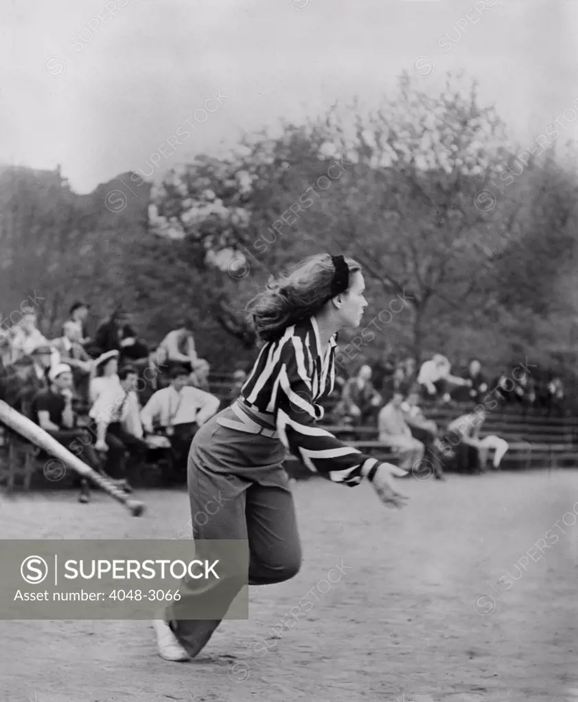 New York City, woman playing softball with other members of Othello production, Central Park, circa 1943-1944.