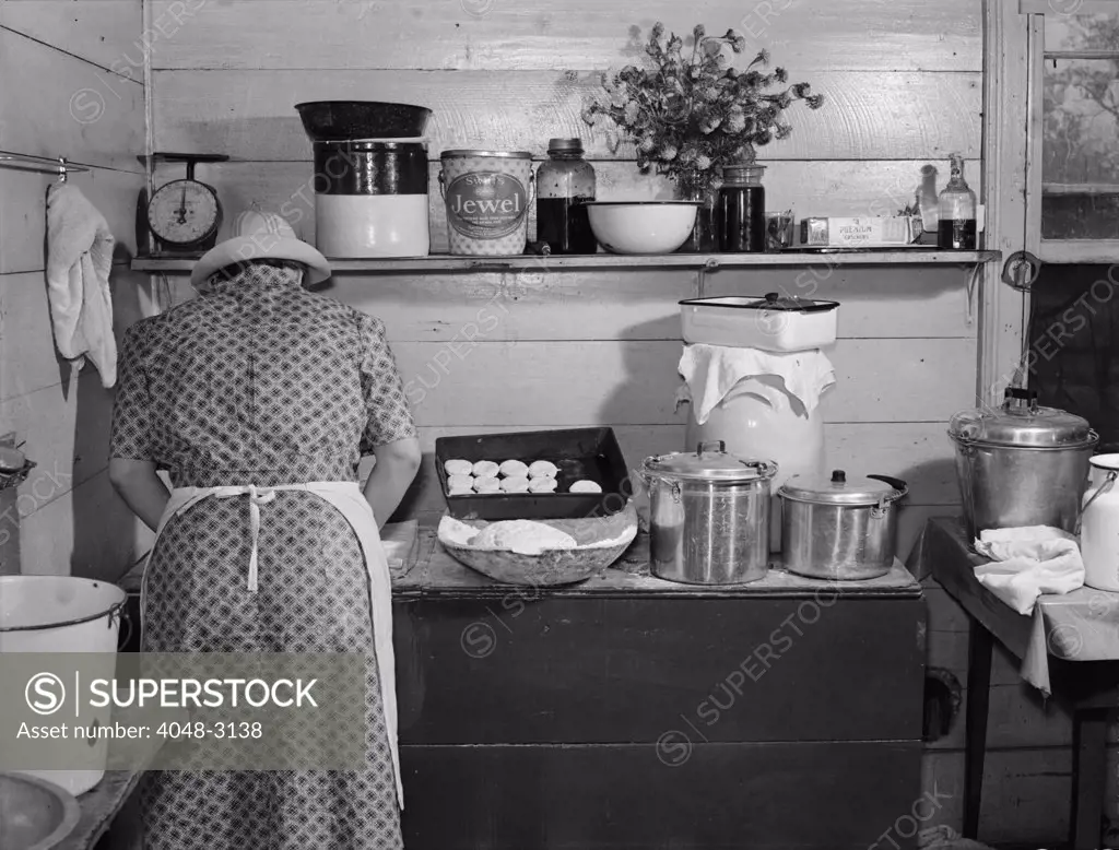 Mary Wilkins baking biscuits for dinner on cornshucking day near Tallyho, photograph by Marion Post Wolcott, North Carolina, September, 1939.