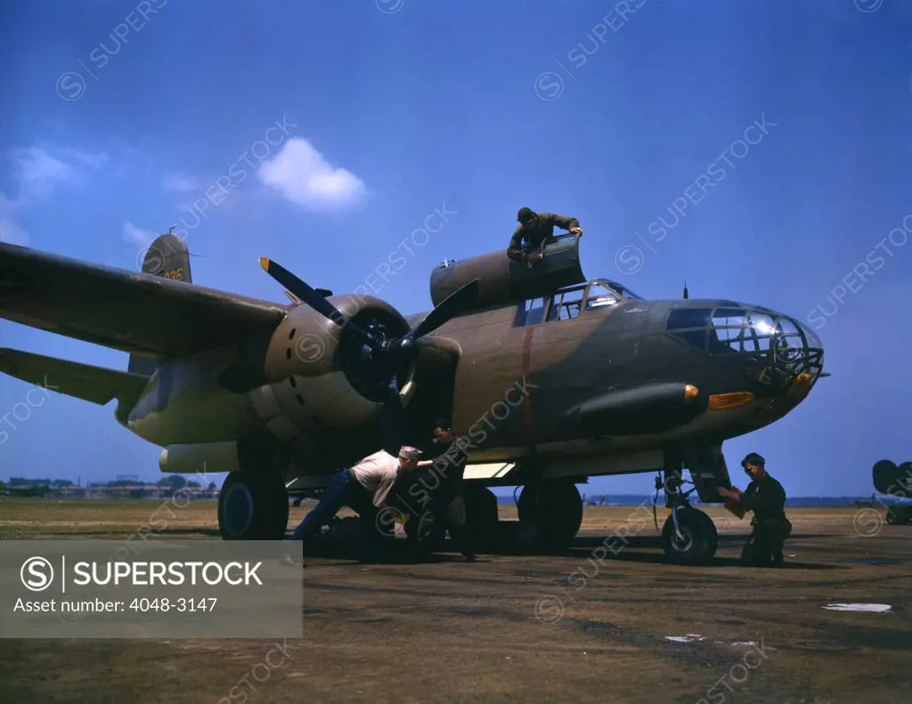 World War II, servicing an A-20 bomber, photograph by Alfred T. Palmer, Langley Field, Viginia, July, 1942.