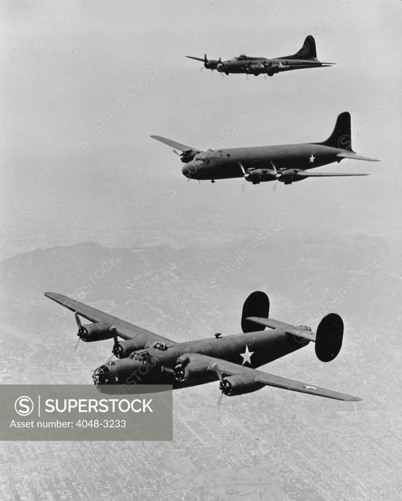World War II, United States planes in echelon formation, from the top: Boeing Flying Fortress B17, Douglas Transport, Consolidated Liberator B-24, circa 1942.
