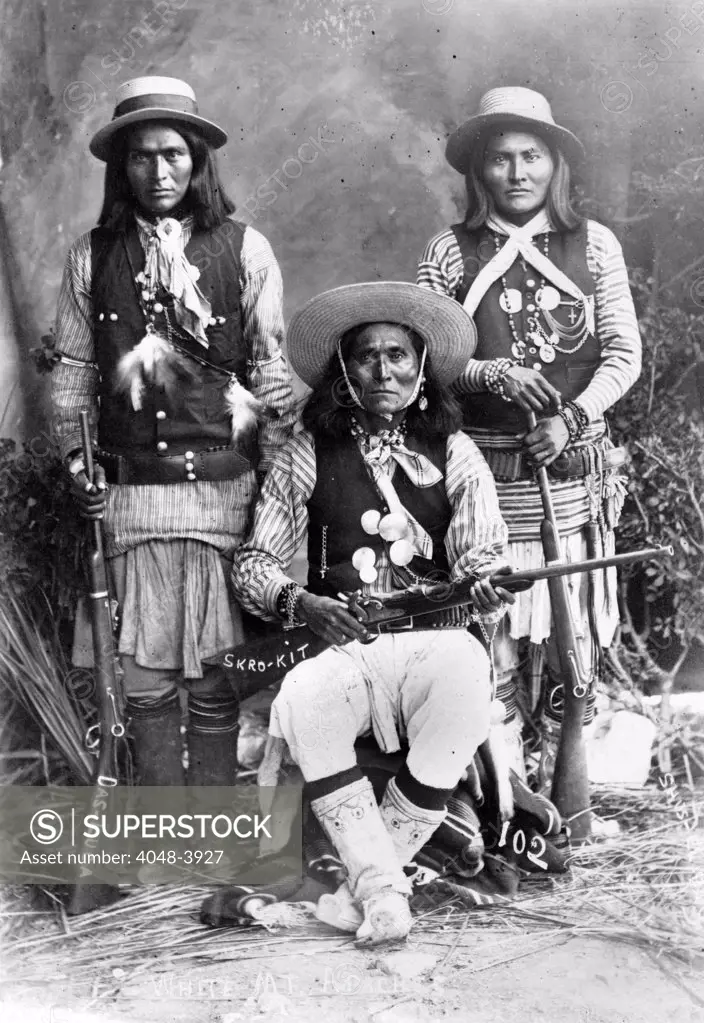 Wild West. Das-Luca, Skro-Kit, Shus-El-Day: White Mountain Apaches posed with rifles, 1909