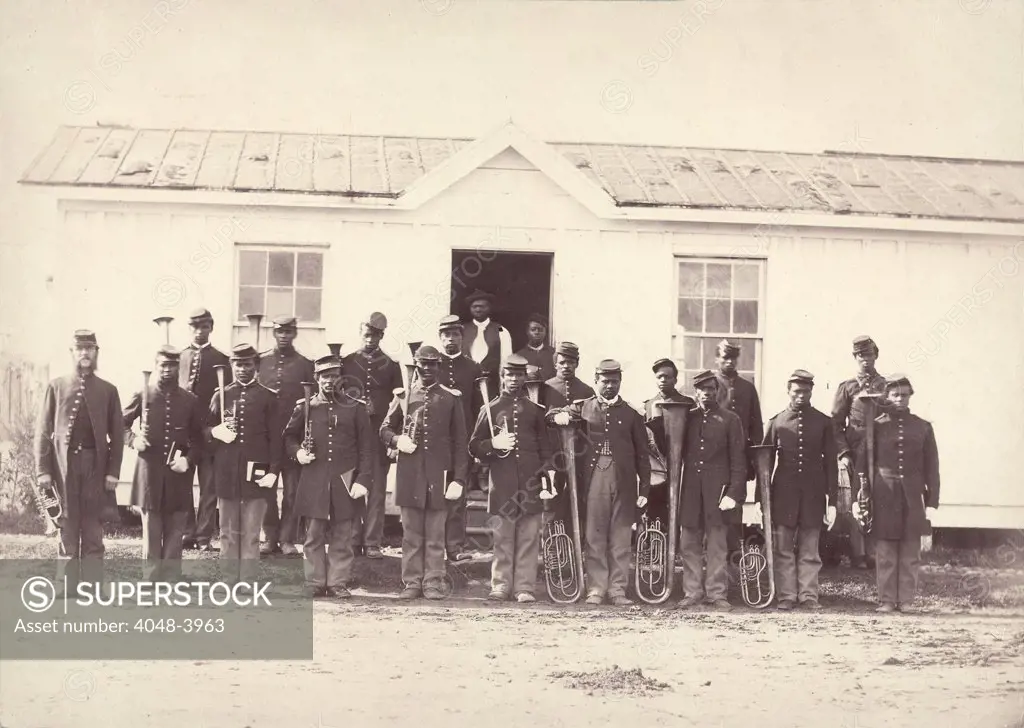 The Civil War, group of 21 African American men holding musical instruments, title: 'Band of 107th U.S. Colored Infantry', Arlington, Virginia, photograph by William M. Smith, 1865.