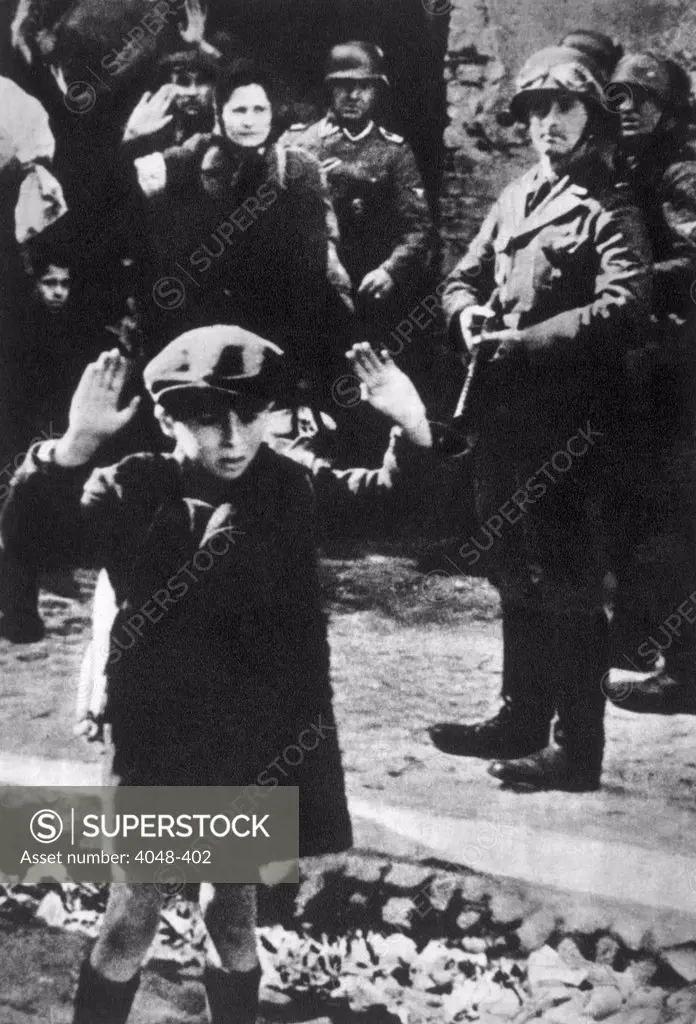 German soldiers rounding up Jews in the Warsaw Ghetto, 1943.