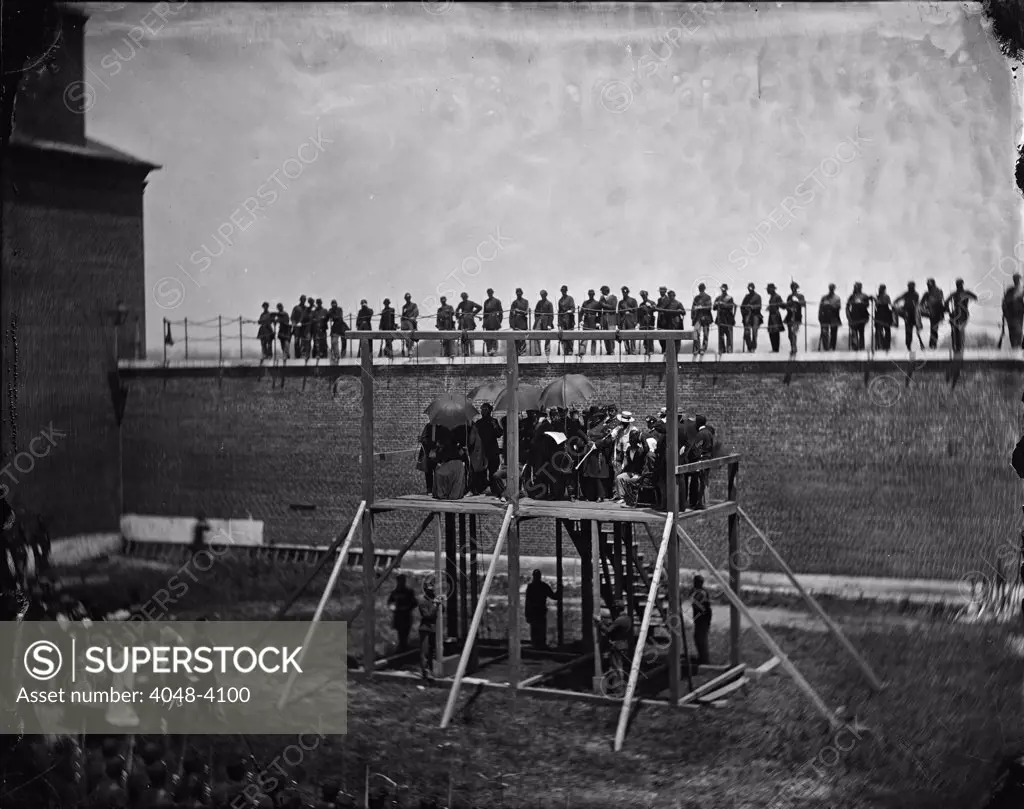 The assassination of President Abraham Lincoln, General John F. Hartranft reading the death warrant to the conspirators on the scaffold, Washington DC, photograph by Alexander Gardner, July 7, 1865.