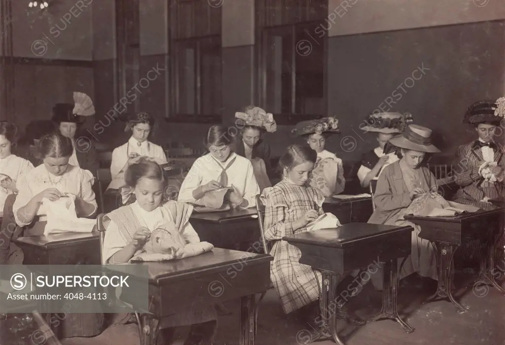 Learning to embroider in the free evening school, Boston Massachusetts, photograph by Lewis Wickes Hine, October, 1909.