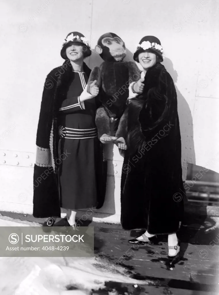 Dolly Sisters with a monkey doll, ca. 1923-25