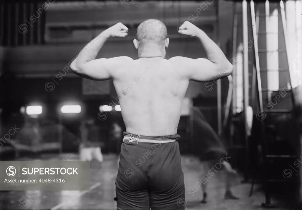 Strong man flexing muscles, Yussif Mahmout, photograph, circa 1900s-1920s
