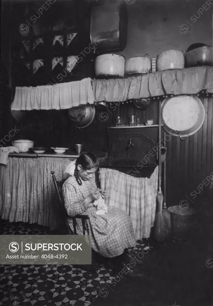 Child labor, original caption: 'Carmela Picciano, 311 E. 149th Street, 3rd floor rear. 12 years old. Making Irish lace for collars. Works until 9 P.M. sometimes. Dirty kitchen', New York, photograph by Lewis Wickes Hine, January, 1912
