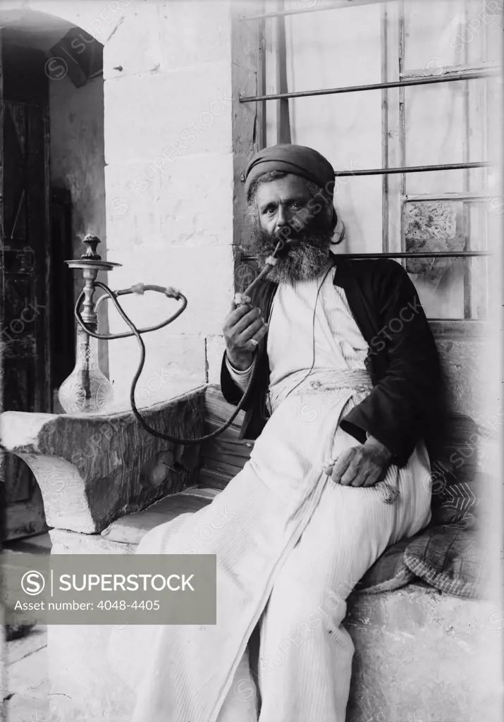 The Samaritans of Nablus (Shechhem). A Samaritan smoking the narghileh, photograph, 1900-1920