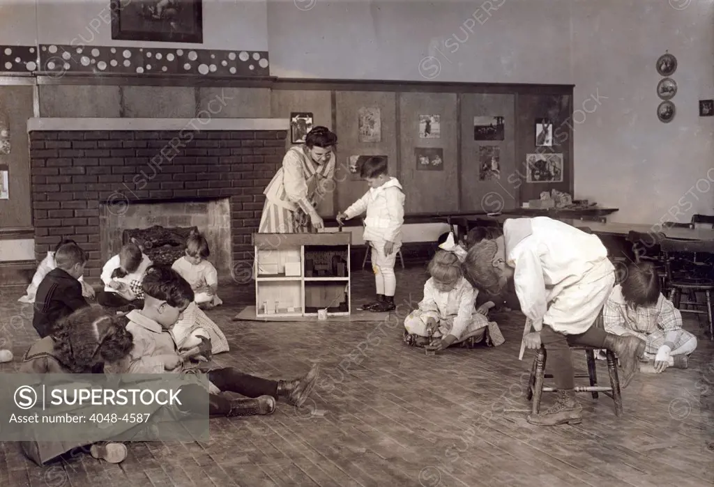 Kindergarten children in Horace Mann School working on doll houses. Tulsa, Oklahoma, Lewis Hine photograph, 1917