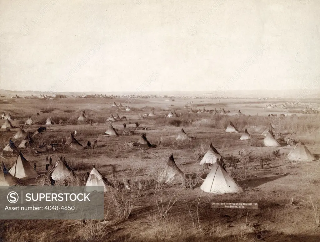 The Great Hostile Camp. Bird's-eye view of a Lakota SIoux camp, probably on or near Pine Ridge Reservation, South Dakota. photo by John C. Grabill, 1891