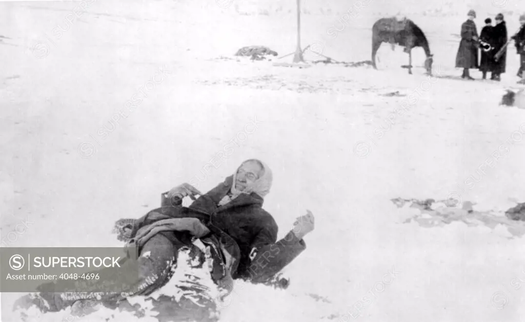 Big Foot, leader of the Sioux, captured at the battle of Wonded Knee, here he lies frozen on the snow covered battlefield where he died, photograph, 1890