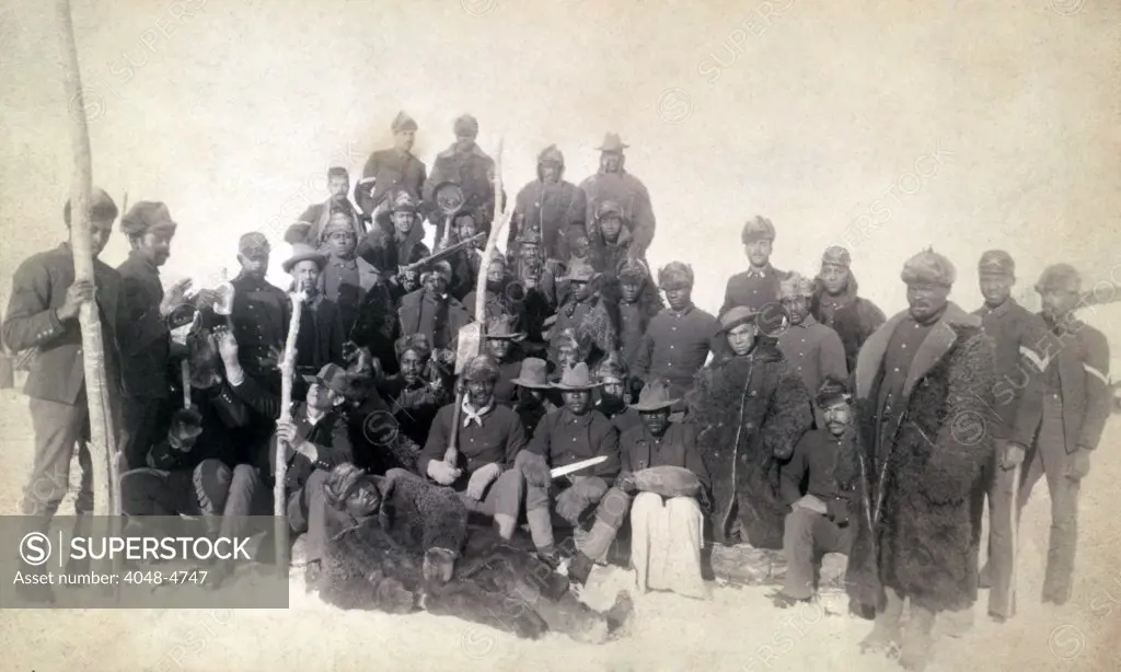 Buffalo soldiers of the 25th Infantry, some wearing buffalo robes, Ft. Keogh, Montana. cabinet card ca. 1890