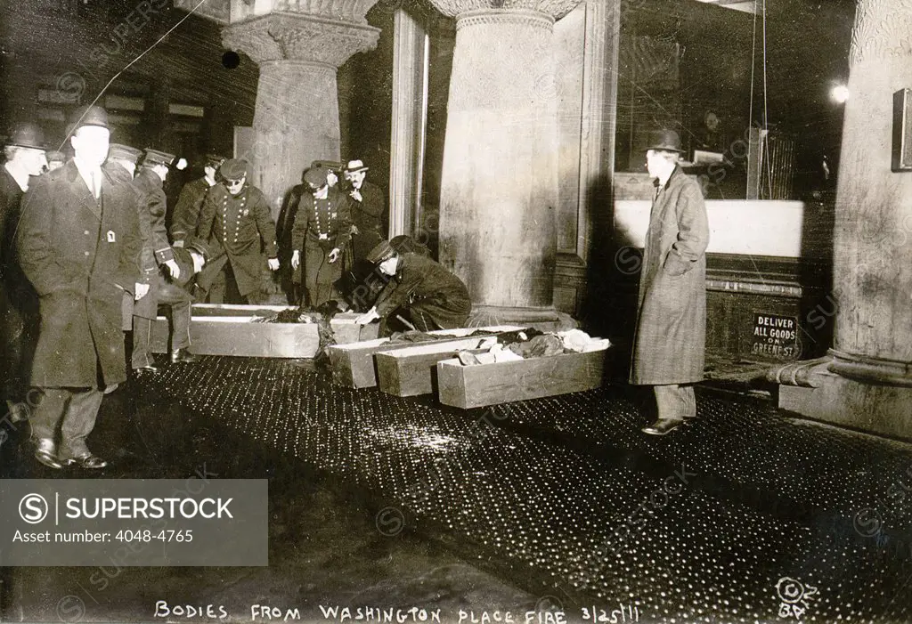 Bodies from Triangle Shirtwaist fire. City officials placing Triangle Shirtwaist Company fire victims in coffins. March 25, 1911