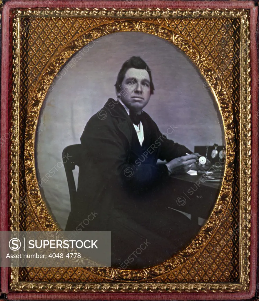 Occupational portrait of a watchmaker, seated at table with watches. sixth plate daguerreotype ca. 1840-1860
