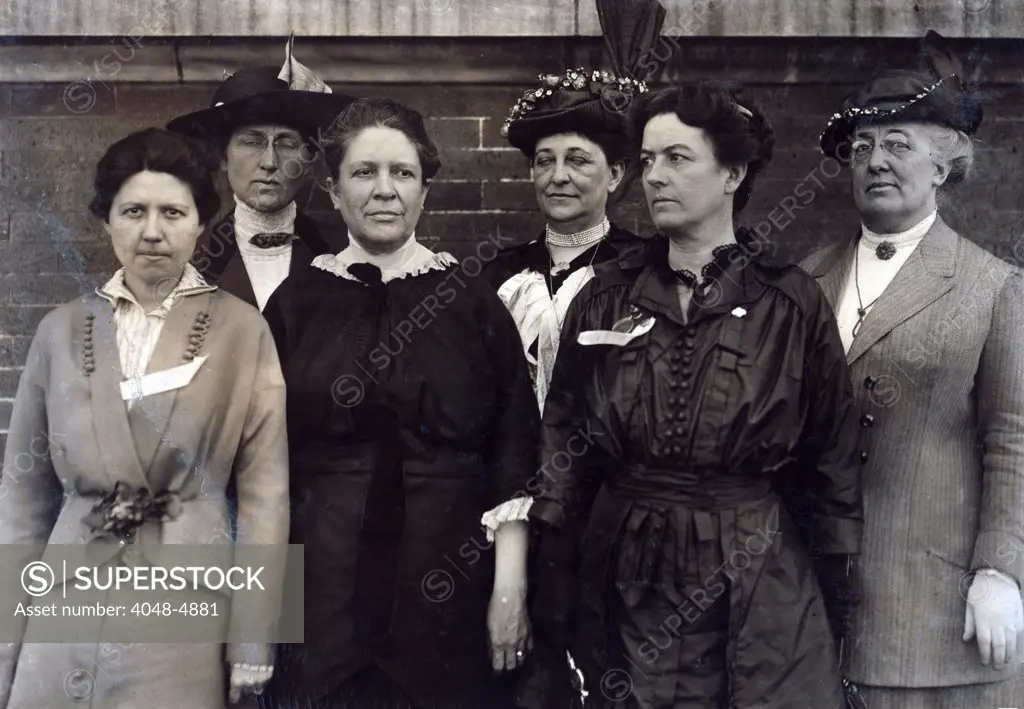Mrs. Florence Kelley, Chief State Factory Inspector of Illinois, 1893-97 (3rd from left), surrounded by other factory inspectors. Lewis Hine Wickes photograph, March 1914.