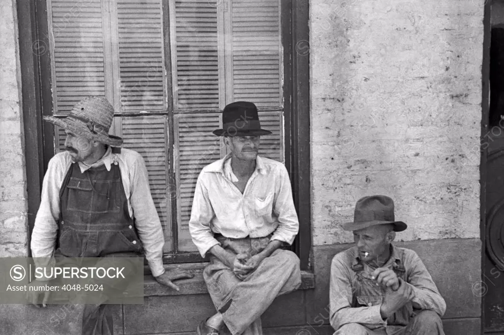 Frank Tengle, Bud Fields, and Floyd Burroughs, cotton sharecroppers. Hale County, Alabama. Published in the book, 'Let Us Now Praise Famous Men'. photograph by Walker Evans, 1936.