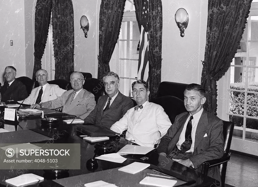 President Harry S. Truman with his cabinet. (from left to right) Postmaster General Robert Hannegan; Secretary of War Henry Stimson; Secretary of State James Byrnes; the President; Secretary of the Treasury Fred Vinson; Attorney General Tom Clark; and Secretary of the Navy James Forrestal. ca. 1949