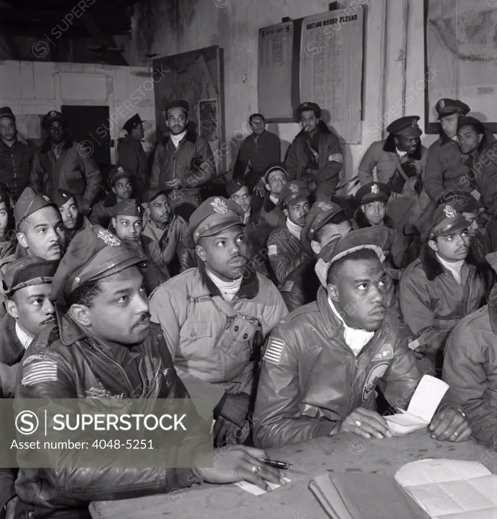 Tuskegee airmen attend a briefing in Ramitelli, Italy, March 1945. Photograph by Toni Frissell.