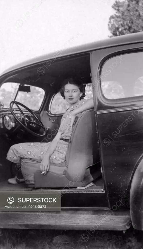 Woman sitting in car, Texas, 1937