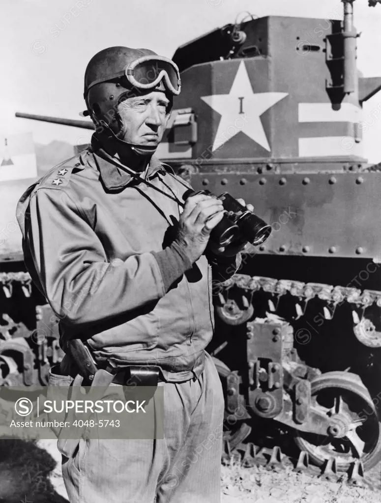 General George S. Patton (1885-1945), U.S. Army General, commanding officer of First Armored corps observing M3 Tanks on Training maneuvers in May 1942.