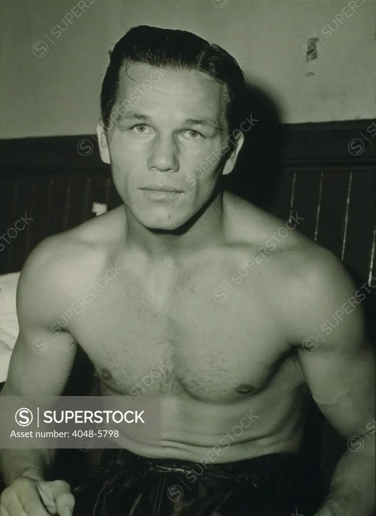 Tony Zale (1914-1997), two-time world middleweight champion. Zale was called the 'Man of Steel' for his endurance in the ring and ability to wear his opponents out with body punches. 1941.