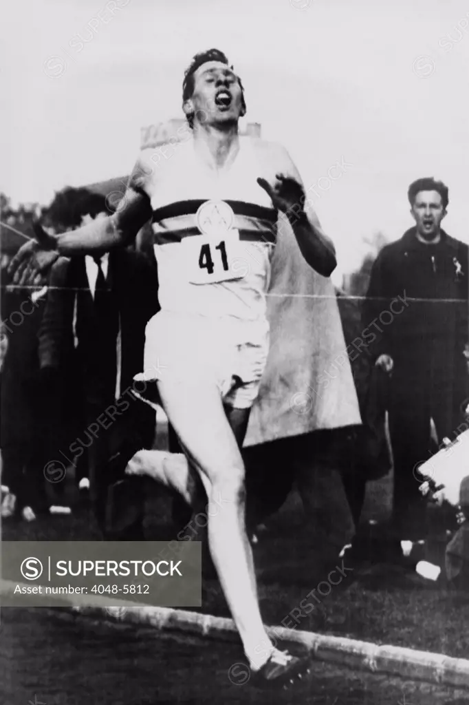 Roger Bannister crossing the finish line in three minutes and 59.4 seconds, achieving the four-minute mile, Oxford, England on May 6, 1954.