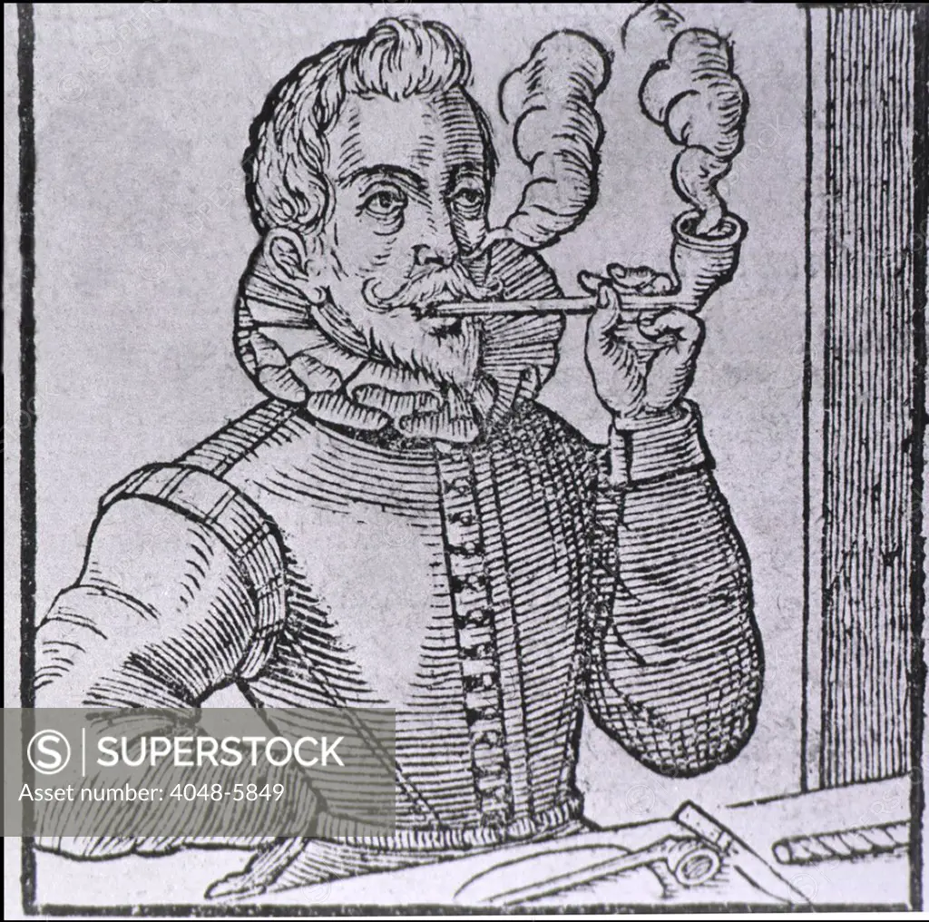 16th century Dutchman smoking a long-stemmed pipe, with another pipe and roll of tobacco on the table.  Pipe smoking was introduced to Europe in the 16th century by sailors returning from the New World. 1595 wood engraving.