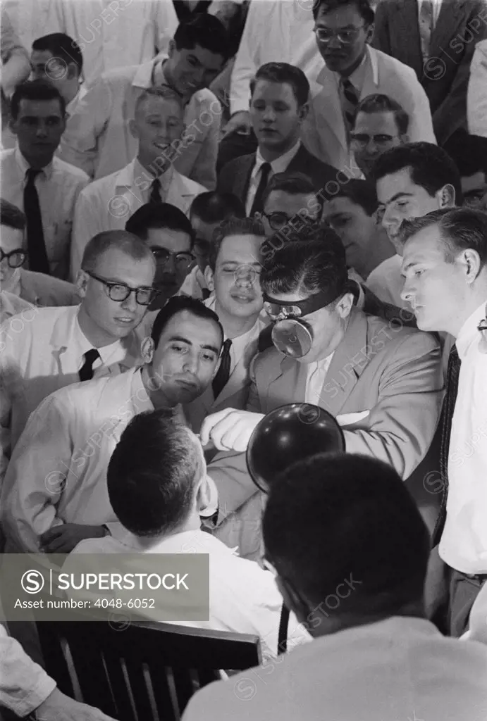 All male class of medical students receiving clinical instruction at George Washington University Medical School, in April 1958.