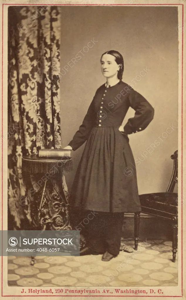 Dr. Mary Edwards Walker (1832-1919), Civil War surgeon. She is the only known female physician to serve in battle during the U.S. Civil war. She is wearing her reformist dress, consisting of full length slacks under an abbreviated full skirt and uncorseted jacket. Photograph by John Holyland,ca. 1865.