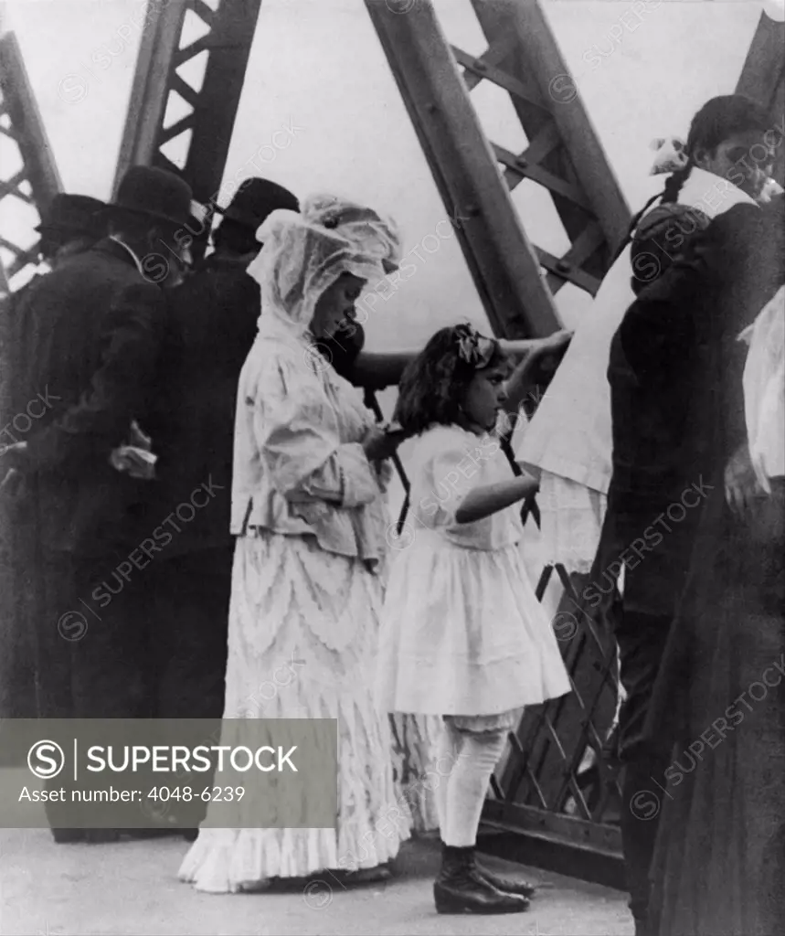 Jews praying on the Williamsburg Bridge on Yom Kippur, the Jewish New Year. Ca. 1909.